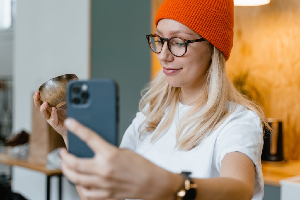 Girl trying to film her first UGC video for TikTok.